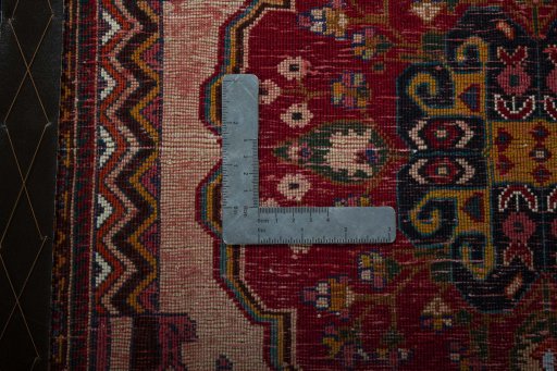 Backside of handmade 2000s Shiraz rug showing knot structure and weave density
