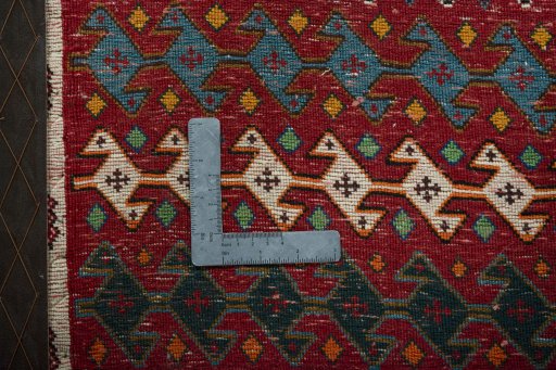 Backside of handmade 2000s Shiraz rug showing knot structure and weave density