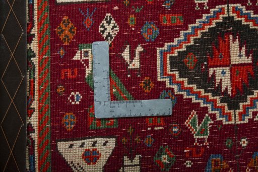 Backside of handmade 2000s Shiraz rug showing knot structure and weave density