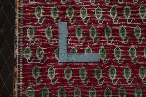 Backside of handmade 2000s Shiraz rug showing knot structure and weave density