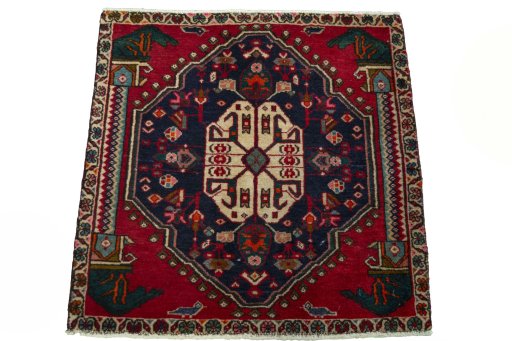 Surface texture of 2000s Shiraz rug with natural Wool and intricate pattern
