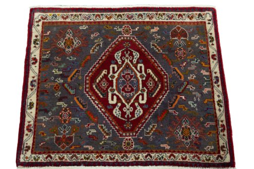 Surface texture of 2000s Shiraz rug with natural Wool and intricate pattern