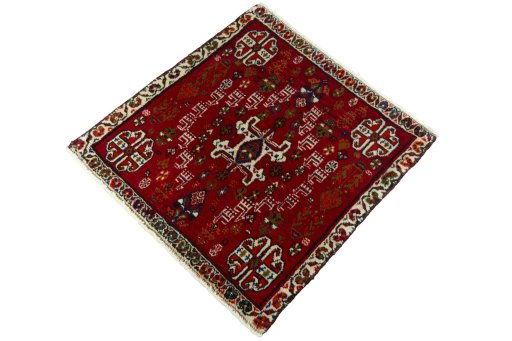 Corner detail of 2000s Shiraz rug showing border pattern and Wool pile