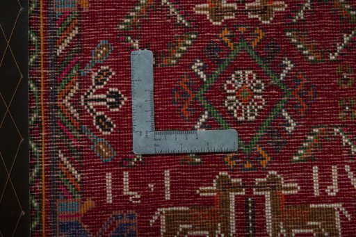 Backside of handmade 2000s Shiraz rug showing knot structure and weave density