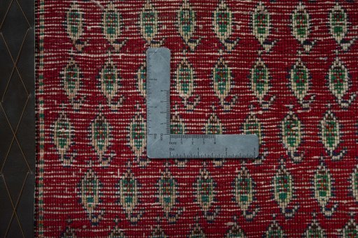 Backside of handmade 2000s Shiraz rug showing knot structure and weave density