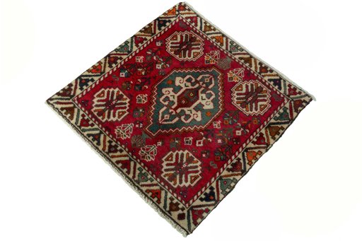 Corner detail of 2000s Shiraz rug showing border pattern and Wool pile