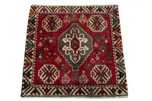 Surface texture of 2000s Shiraz rug with natural Wool and intricate pattern