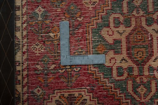 Backside of handmade 2000s Shiraz rug showing knot structure and weave density