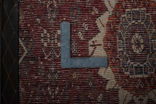 Corner detail of 2000s Shiraz rug showing border pattern and Wool pile