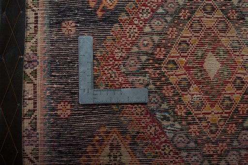 Backside of handmade 2000s Shiraz rug showing knot structure and weave density