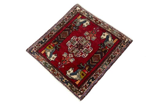 Corner detail of 2000s Shiraz rug showing border pattern and Wool pile