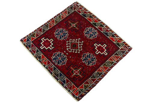 Corner detail of 2000s Shiraz rug showing border pattern and Wool pile