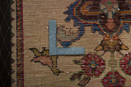 Backside of handmade 2000s Shiraz rug showing knot structure and weave density