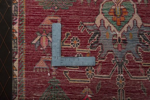Backside of handmade 2000s Shiraz rug showing knot structure and weave density