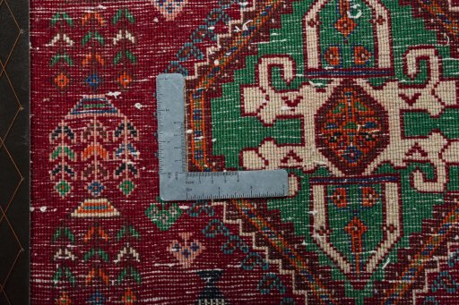 Backside of handmade 2000s Shiraz rug showing knot structure and weave density