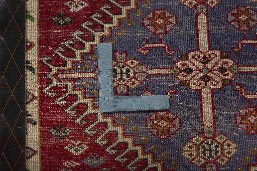 Backside of handmade 2000s Shiraz rug showing knot structure and weave density