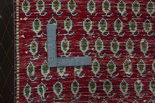 Backside of handmade 2000s Shiraz rug showing knot structure and weave density