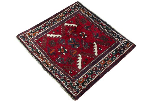 Corner detail of 2000s Shiraz rug showing border pattern and Wool pile