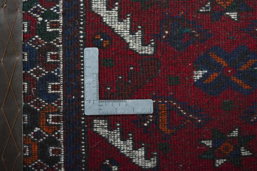 Backside of handmade 2000s Shiraz rug showing knot structure and weave density