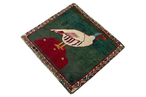 Corner detail of 2000s Shiraz rug showing border pattern and Wool pile