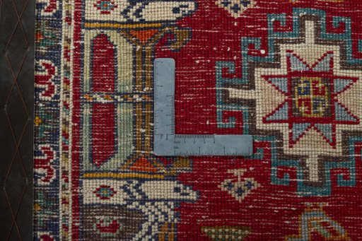 Backside of handmade 2000s Shiraz rug showing knot structure and weave density
