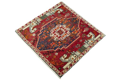 Corner detail of 2000s Shiraz rug showing border pattern and Wool pile