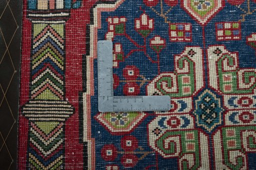 Backside of handmade 2000s Shiraz rug showing knot structure and weave density