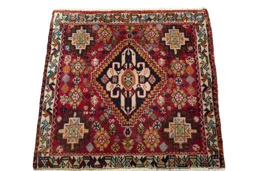 Surface texture of 2000s Shiraz rug with natural Wool and intricate pattern