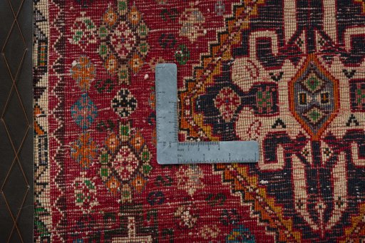 Backside of handmade 2000s Shiraz rug showing knot structure and weave density