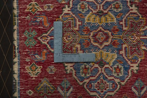 Backside of handmade 2000s Shiraz rug showing knot structure and weave density