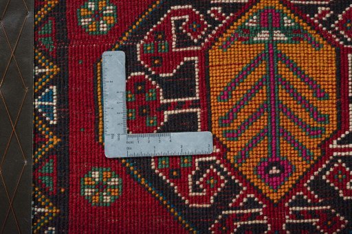 Backside of handmade 2000s Shiraz rug showing knot structure and weave density