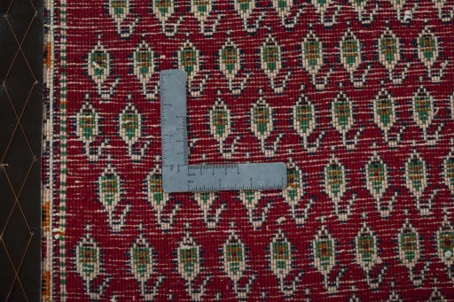 Backside of handmade 2000s Shiraz rug showing knot structure and weave density