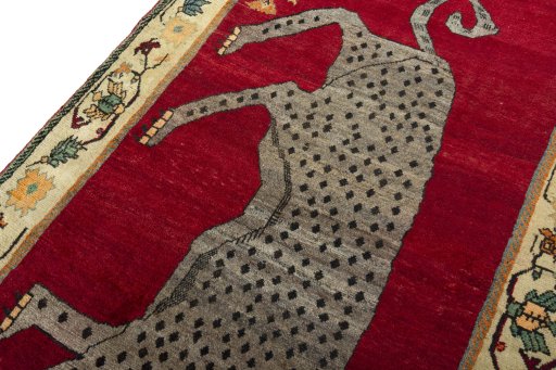 Backside of handmade 2000s Shiraz rug showing knot structure and weave density