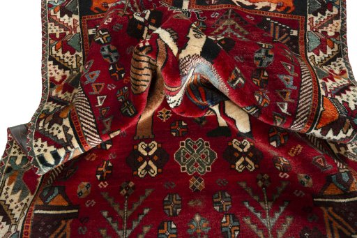 Corner detail of 2000s Shiraz rug showing border pattern and Wool pile