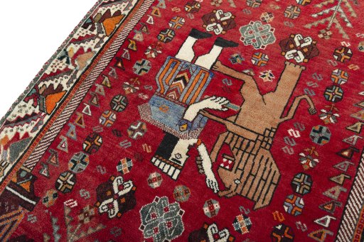 Backside of handmade 2000s Shiraz rug showing knot structure and weave density