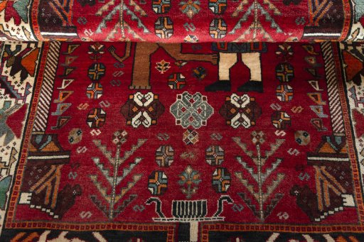 Full view of 2000s Shiraz rug from Iran / Persia, 174 × 116 cm in Red tones