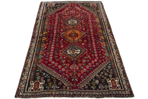 Surface texture of 2000s Shiraz rug with natural Wool and intricate pattern
