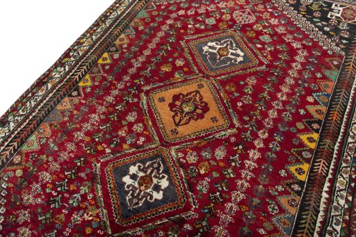 Backside of handmade 2000s Shiraz rug showing knot structure and weave density