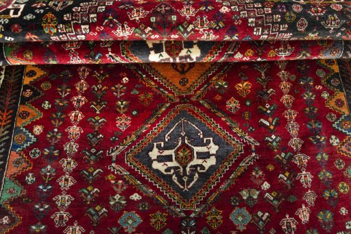 Full view of 2000s Shiraz rug from Iran / Persia, 253 × 164 cm in Red tones