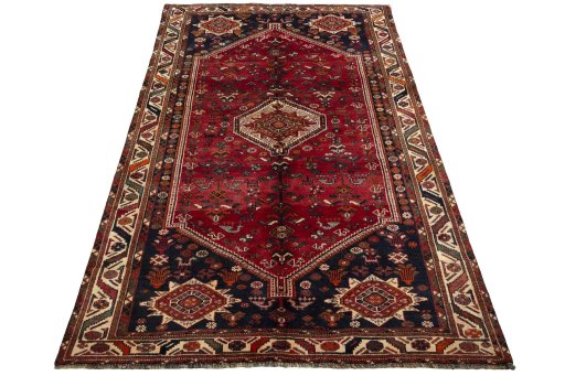 Surface texture of 2000s Shiraz rug with natural Wool and intricate pattern