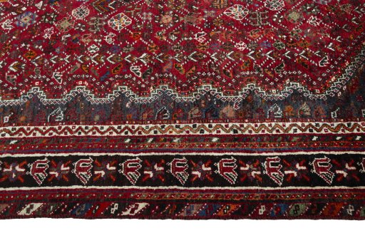 Full view of 1970s Shiraz rug from Iran / Persia, 317 × 217 cm in Red tones