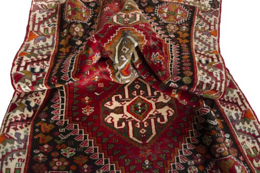 Corner detail of 2000s Shiraz rug showing border pattern and Wool pile