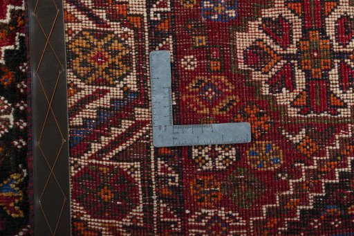 Surface texture of 2000s Shiraz rug with natural Wool and intricate pattern
