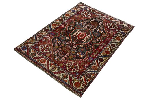 Corner detail of 2000s Shiraz rug showing border pattern and Wool pile