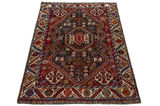 Surface texture of 2000s Shiraz rug with natural Wool and intricate pattern