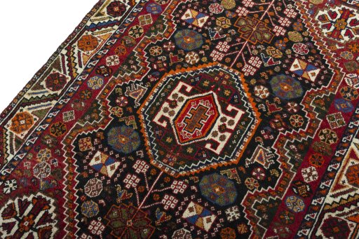 Backside of handmade 2000s Shiraz rug showing knot structure and weave density