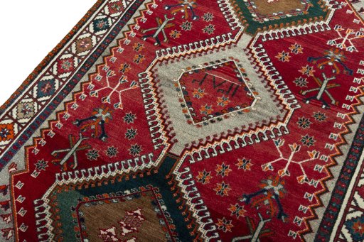 Backside of handmade 2000s Shiraz rug showing knot structure and weave density