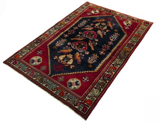 Corner detail of 2000s Shiraz rug showing border pattern and Wool pile
