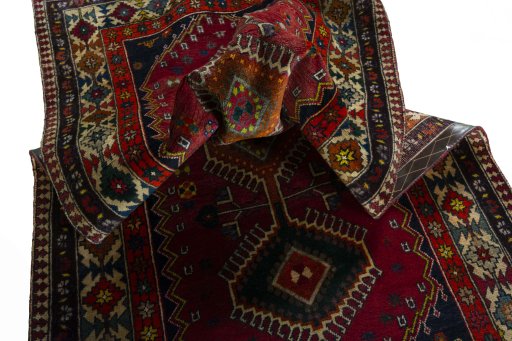 Corner detail of 2000s Shiraz rug showing border pattern and Wool pile