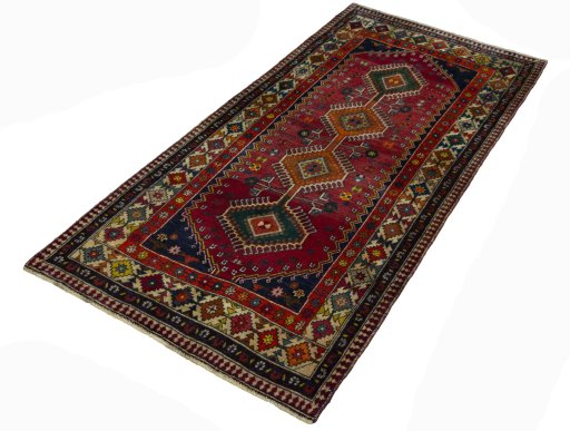 Corner detail of 2000s Shiraz rug showing border pattern and Wool pile